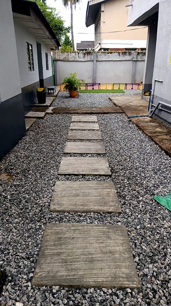 Walkway through the Flourish Playhouse campus
