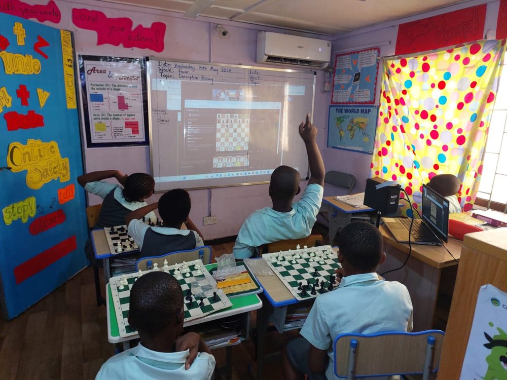 Children exploring chess and ICT learning at Flourish Playhouse