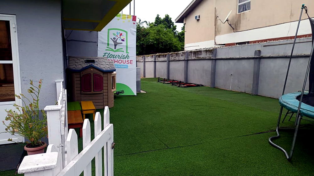 Kids playhouse on the artificial lawn at Flourish Playhouse